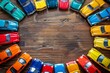 Top view of vibrant toy car collection arranged in circular fashion in childs playroom