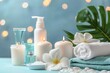 Relaxing spa setting with candles, towels, and flowers. Perfect for wellness and beauty concepts