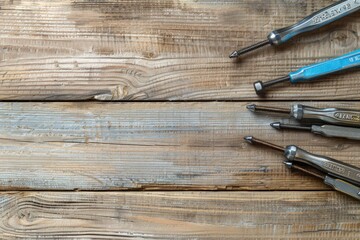 Wall Mural - Various tools arranged on a wooden table, suitable for DIY projects