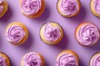 A bunch of cupcakes with purple frosting on a pink surface. Perfect for bakery or dessert concepts