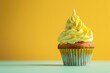 Delicious cupcake with yellow frosting on a table, perfect for bakery or dessert concepts
