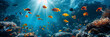 A group of fish swimming under the sunbeams in the ocean.