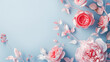 Decorative pink flowers on a blue background. Copy space, greeting card