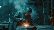 Skillful metal worker working with arc welding machine in factory while wearing safety equipment. Metalwork manufacturing and construction maintenance service by manual skill labor concept.