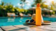 Sunscreen, sunglasses, and a straw hat on a poolside deck indicate a sunny day meant for relaxation and sun protection.