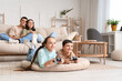 © Pixel-Shot - Little children playing video game and his parents at home
