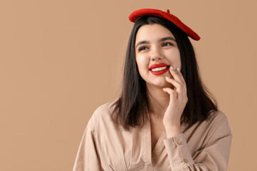 Poster - Happy young woman with red lips on brown background