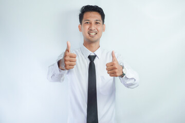 Young Asian businessman smiling and giving two thumbs up