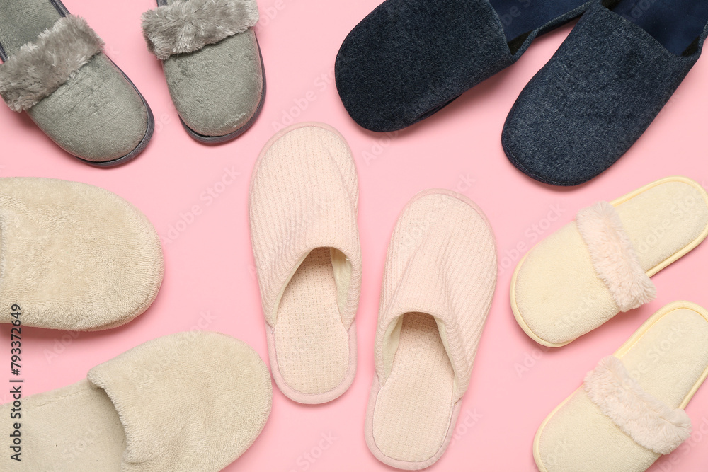 Many pairs of slippers on pink background. Top view