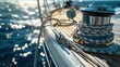 A winch on a sailing yacht is used to effortlessly hoist sails and ropes amid the stunning backdrop of the summer sea an essential feature of any well equipped sailing vessel that enhances e