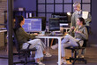 © Pixel-Shot - Group of female programmers working in office at night