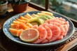 freshly sliced fruits platter with watermelon, kiwi, and citrus on blue plate