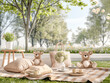 Two teddy bears enjoy a charming picnic setup with cushions and a tea set on a plaid blanket in a peaceful park setting.
