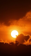 Wall Mural - timelapse of dramatic sunrise with orange sky in a cloudy day.