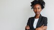 © Exnoi - A Black female engineer in a stylish blazer, with a confident, assertive expression, arms crossed, on a stark white background, styled as an empowering corporate portrait.
