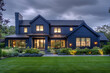 A navy blue modern home under cloudy skies, its landscaping diverse and neat, enhancing the serene setting in ultra HD.