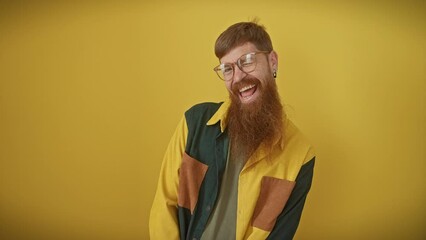 Sticker - Cheerful young redhead guy playfully winks at the camera, sporting glasses and shirt. basking in joy, his happy face is simply radiating with sexy appeal, standing out over a vibrant yellow background