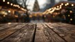 Defocused view of a lively Christmas market, glowing with festive lights.