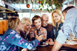 © Davor - Multigenerational family enjoying time at a cafe