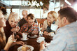 © Davor - Multigenerational family enjoying time at a cafe