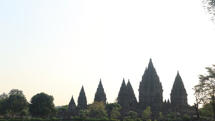 View of the temple in the ancient Prambanan temple complex with the evening sky in the background. Popular tourist destination.