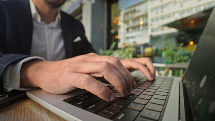 Wall Mural - Handsome 30s top manager work laptop close up. Entrepreneur type computer macbook keyboard. Business man look monitor. Young male businessman. 40s employee create start up closeup. Ceo office boss job