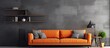 An orange couch against a black wall in a modern living room