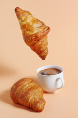 Wall Mural - Croissant hanging over coffee