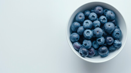 Sticker - Blueberries in a bowl on a white table top view space on the left