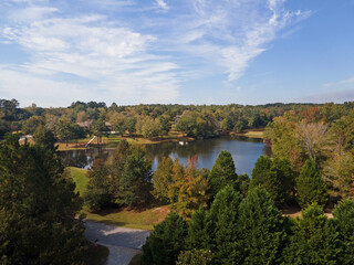 Naklejka na meble Aerial sunset landscape of forest and lake in rural neighborhood CSRA Grovetown Augusta Georgia