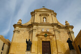 Fototapeta Dmuchawce - Entrance portal of the Cathedral of the Assumption, Victoria, Gozo, Malta  