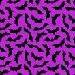 Halloween Bat flat seamless pattern. Vector Happy Halloween print with flying black bat silhouette on violet background. For wrapping, fabric, holiday decoration, textile, wallpapers