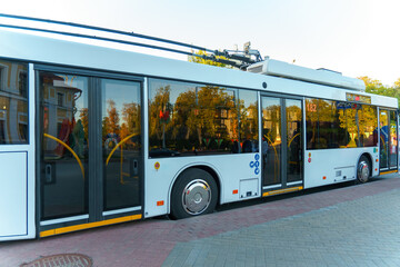 A new modern bus. Modern public electric transport. Details of the bus in close-up, headlights, windshield, driver's cabin.