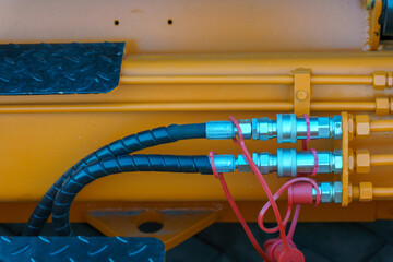 Spiral cable connecting truck cabin and trailer. Pneumatic hoses and electric cables on the coupler of the hitch between a tractor truck and its semi-trailer. Hydraulic control system in new cars.