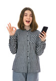 Fototapeta Natura - Portrait of pretty eighteen years old womantake selfie and make OK signs, isolated on white background. Studio shot of young woomen holding cell phone and having video call.