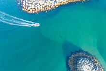 Aerial Top View With Drone Of A Fishing Boat Entering A Harbor
