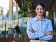 © peopleimages.com - Business portrait, woman and restaurant owner with arms crossed at entrance for startup, service or confidence. Entrepreneur, face and girl at cafe with career, goal and pride for coffee shop success