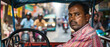 A rickshaw driver expertly maneuvers through busy city streets filled with people and buildings.