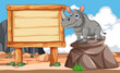 Cartoon rhino standing next to a signboard