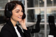 Woman professional helpline call center agent in wireless headset