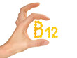 Vitamin B Pills isolated - B12 on white background with Woman Hand
