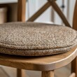 © Yevheniiya - Cozy Knitted Chair Cushion in Sunlit Room. Generative ai