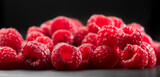 Fototapeta  - Raspberry fresh berries closeup, ripe fresh organic Raspberries over black background, macro shot. Harvest concept