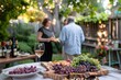 An intimate summer garden gathering featuring friends, gourmet appetizers, and wine in a beautifully decorated backyard setting with warm lights.