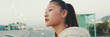 © Andrii Nekrasov - Asian girl wears sportswear, climbs stairs, looks up at morning time, Panorama