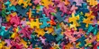 © xartproduction - A pile of colorful jigsaw puzzle pieces