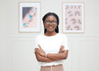 © peopleimages.com - African woman, portrait and office with arms crossed, smile and confidence for goals. Creative writer, professional news editor and expert reporter for content creation, publishing and press startup