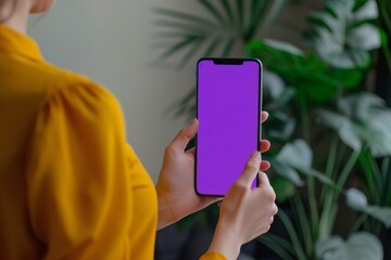 Ui mockup woman in her 40s holding an smartphone with an entirely purple screen