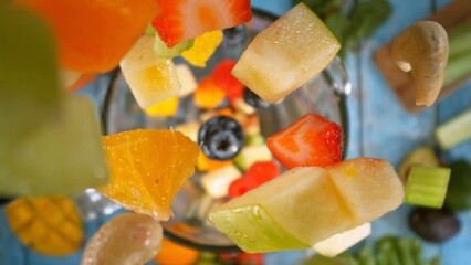 Wall Mural - Falling Pieces of Fruits and Vegetables into Blender.