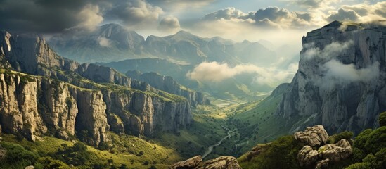 Poster - Valley landscape with mountain and cloud backdrop